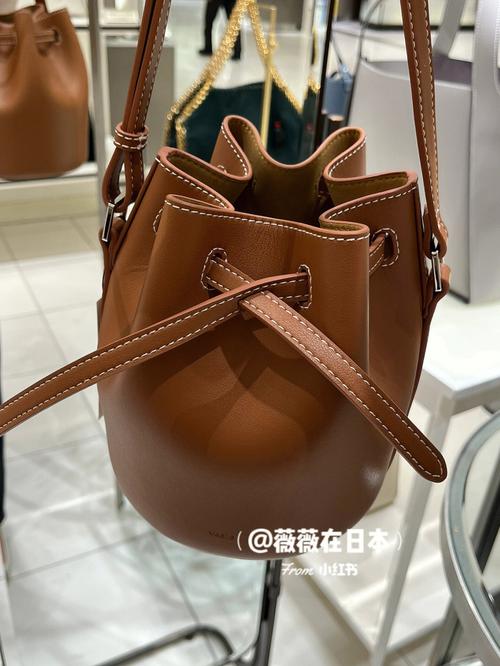 在日本买了一个包,包包费用25000日元,加上3500的税,最后一共..._百度...